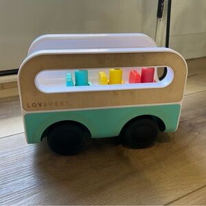 Lovevery Wheel Around Town Bus Children Toy With Three Peg People The Realist